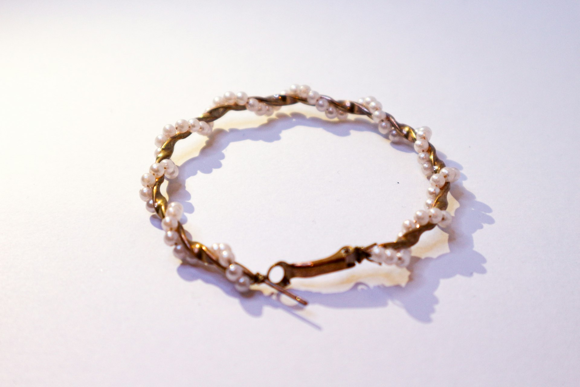 a close up of a bracelet on a table